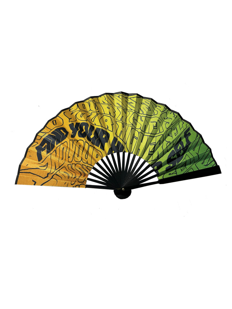 A fashionable and foldable fan with a black side featuring the repeated GRAV logo and a vibrant gradient from green to orange with the “Find your higher self” phrase on the reverse.